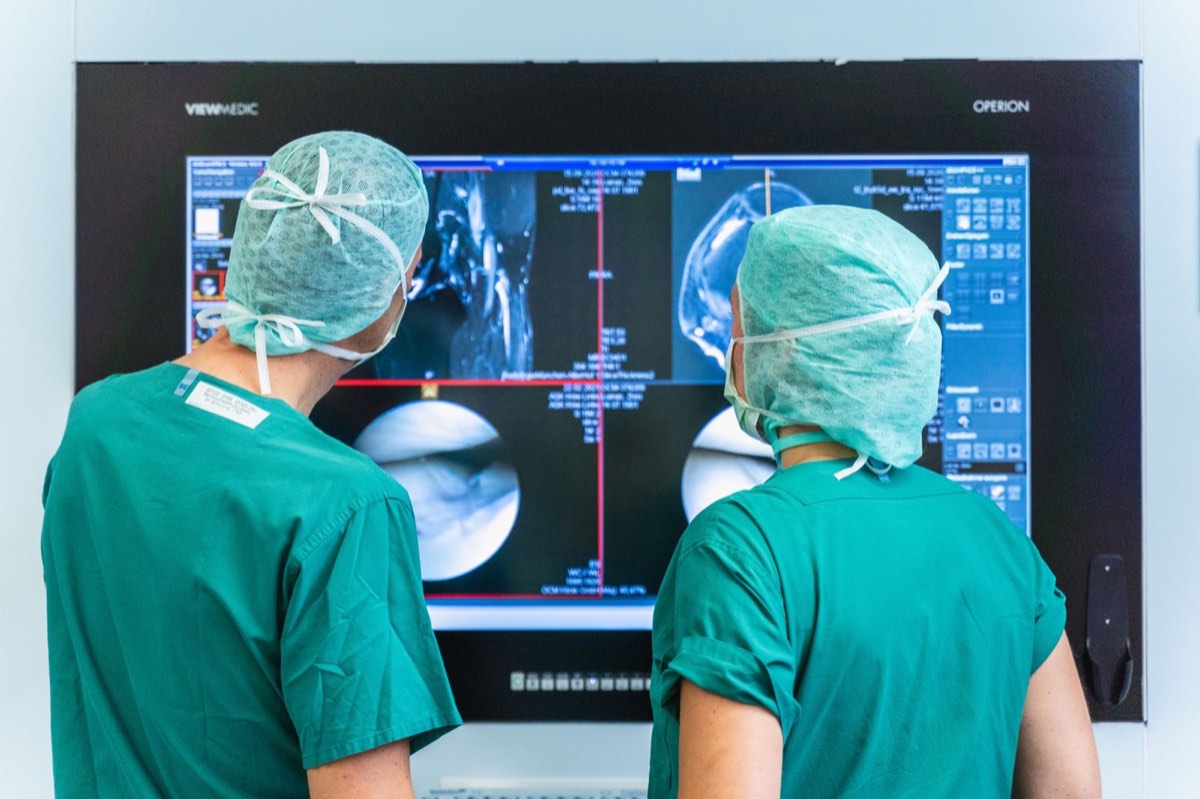 Medical team reviewing knee imaging together